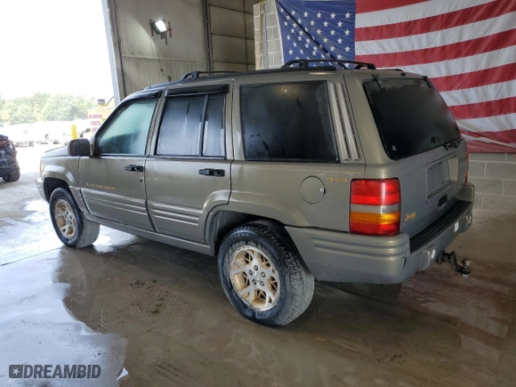 1998 Jeep Grand Cherokee Limited with VIN 1J4GZ78Y8WC285670, listed as a Copart auction lot 70213044 with 128382 miles and Clean Title. Bid and sale history available at carsss.com. Image 2.