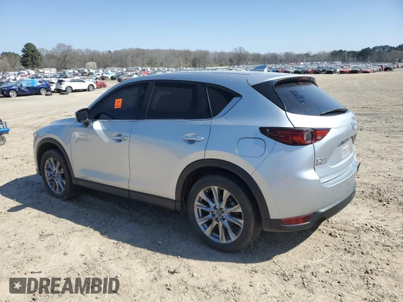 2021 Mazda CX-5 Grand Touring with VIN JM3KFADM6M0387094, listed as a Copart auction lot 48350845 with 94,701 mi miles and Salvage Title. Bid and sale history available at carsss.com. Image 2.