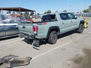 2022 Toyota Tacoma SR with VIN 3TMCZ5AN0NM489420, listed as a IAAI auction lot 42597175 with 129,340 mi miles and . Bid and sale history available at DreamBid. Image 4.