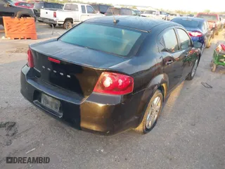 2014 Dodge Avenger SE with VIN 1C3CDZAB3EN148292, listed as a IAAI auction lot 42043642 with 134,676 mi miles. Bid and sale history available at carsss.com. Image 4.