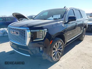 2021 GMC Yukon Denali with VIN 1GKS2DKL1MR135771, listed as a IAAI auction lot 41403680 with 61,772 mi miles. Bid and sale history available at carsss.com. Image 2.