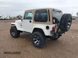 2001 Jeep Wrangler Sahara with VIN 1J4FA59S71P365271, listed as a IAAI auction lot 41889948 with 144,357 mi miles. Bid and sale history available at carsss.com. Image 3.