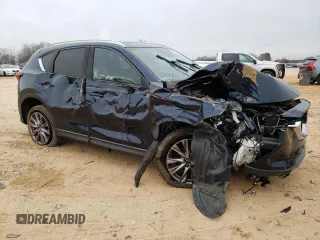 2019 Mazda CX-5 Grand Touring with VIN JM3KFADM0K1596256, listed as a Copart auction lot 86323594 with 118,853 mi miles and Salvage title. Bid and sale history available at DreamBid. Image 4.