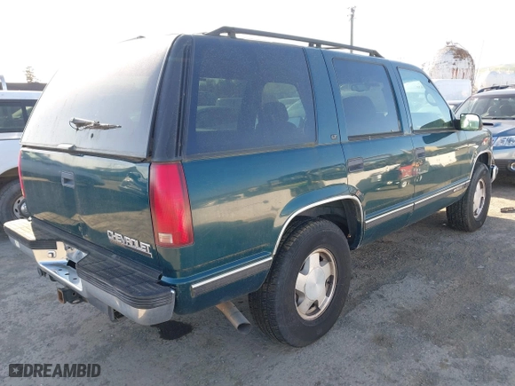 1997 Chevrolet Tahoe with VIN 1GNEK13RXVJ375189, listed as a IAAI auction lot 41959601 with 153,589 mi miles. Bid and sale history available at carsss.com. Image 4.