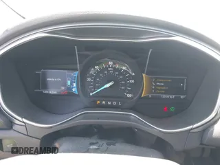 2016 Ford Fusion Titanium Hybrid z VIN 3FA6P0RUXGR123445, wystawiony jako IAAI lot #42606596 z przebiegiem 145 541 mil mil oraz . Historia ofert i sprzedaży dostępna na DreamBid. Obrazek 7.