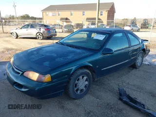 1995 Ford Thunderbird LX with VIN 1FALP62W3SH191775, listed as a IAAI auction lot 41250513 with 150,743 mi miles. Bid and sale history available at carsss.com. Image 2.