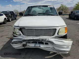 2004 Ford F-150 XL with VIN 2FTRF17294CA59985, listed as a Copart auction lot 55296195 with 220,933 mi miles and Salvage title. Bid and sale history available at DreamBid. Image 5.