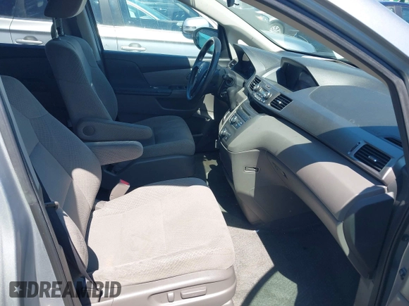 2016 Honda Odyssey LX z VIN 5FNRL5H22GB092614, wystawiony jako IAAI lot #42173633 z przebiegiem 159 387 mil mil oraz . Historia ofert i sprzedaży dostępna na DreamBid. Obrazek 5.