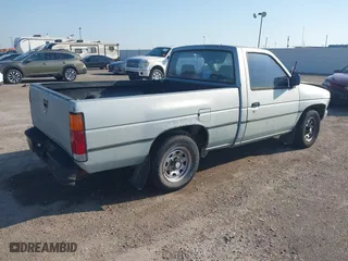 1990 Nissan Trucks 2WD XE with VIN 1N6SD11S4LC400985, listed as a IAAI auction lot 41986390 with 189,924 mi miles. Bid and sale history available at carsss.com. Image 4.