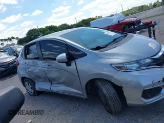 2020 Honda Fit LX z VIN 3HGGK5H44LM729036, wystawiony jako IAAI lot #41840623 z przebiegiem 134 277 mil mil oraz . Historia ofert i sprzedaży dostępna na DreamBid. Obrazek 13.