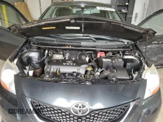 2009 Toyota Yaris z VIN JTDBT903991335683, wystawiony jako Copart lot #52565155 z przebiegiem 143 737 mil mil oraz Szkody całkowita. Historia ofert i sprzedaży dostępna na DreamBid. Obrazek 11.