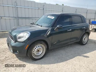 2012 MINI Countryman S with VIN WMWZC5C54CWL57554, listed as a Copart auction lot 59699865 with 144,737 mi miles and Salvage title. Bid and sale history available at DreamBid. Image 1.