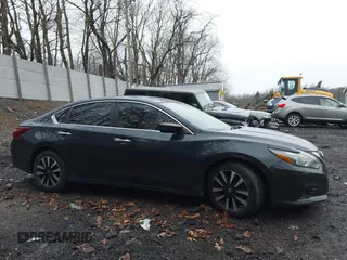 2018 Nissan Altima SV with VIN 1N4AL3AP3JC205875, listed as a IAAI auction lot 41892855 with 159,630 mi miles and . Bid and sale history available at DreamBid. Image 14.