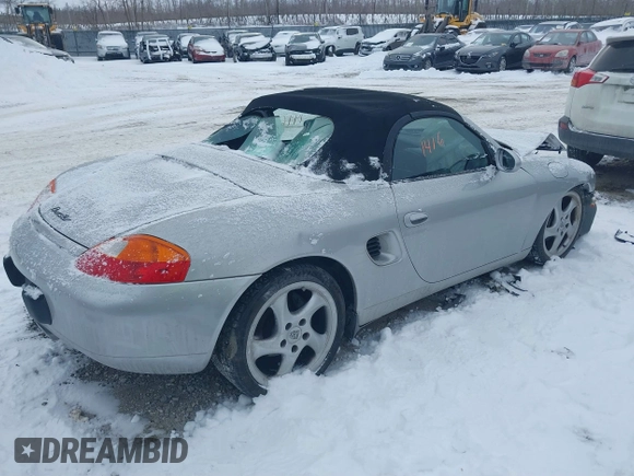 2000 Porsche Boxster z VIN WP0CA2984YU621650, wystawiony jako IAAI lot #41381416 z przebiegiem 71 514 mil mil oraz . Historia ofert i sprzedaży dostępna na DreamBid. Obrazek 4.