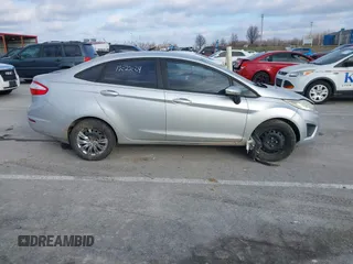 2015 Ford Fiesta SE z VIN 3FADP4BJ1FM220222, wystawiony jako IAAI lot #41209318 z przebiegiem 113 134 mil mil oraz . Historia ofert i sprzedaży dostępna na DreamBid. Obrazek 13.
