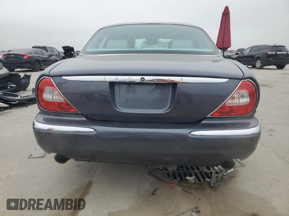 2004 Jaguar XJ with VIN SAJWA71C04SG22878, listed as a Copart auction lot 44383205 with 127,515 mi miles and Clean Title. Bid and sale history available at carsss.com. Image 6.