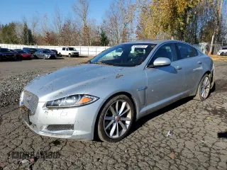 2015 Jaguar XF V6 Portfolio with VIN SAJWA0F7XF8U51105, listed as a Copart auction lot 82865814 with 62,807 mi miles and Salvage Title. Bid and sale history available at carsss.com. Image 1.