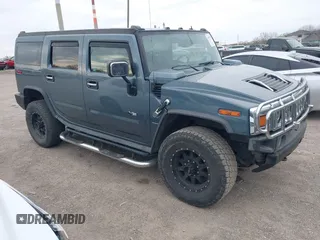 2005 Hummer H2 SUV z VIN 5GRGN23U95H100888, wystawiony jako IAAI lot #41937351 z przebiegiem 202 969 mil mil oraz . Historia ofert i sprzedaży dostępna na DreamBid. Obrazek 1.