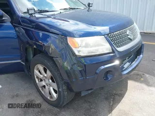 2010 Suzuki Grand Vitara Limited z VIN JS3TE1D9XA4100034, wystawiony jako IAAI lot #42466762 z przebiegiem 189 428 mil mil oraz . Historia ofert i sprzedaży dostępna na DreamBid. Obrazek 12.