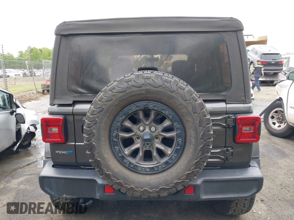 2021 Jeep Wrangler Unlimited Sahara with VIN 1C4JJXP60MW704738, listed as a IAAI auction lot 42042079 with 63,765 mi miles and . Bid and sale history available at DreamBid. Image 16.