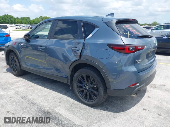 2024 Mazda CX-5 S Carbon Edition z VIN JM3KFBCLXR0521353, wystawiony jako IAAI lot #42351444 z przebiegiem 17 270 mil mil oraz . Historia ofert i sprzedaży dostępna na DreamBid. Obrazek 3.