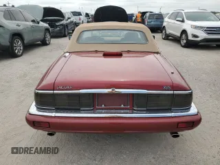 1995 Jaguar XJS with VIN SAJNX2742SC197388, listed as a Copart auction lot 76579714 with 99,077 mi miles and Salvage Title. Bid and sale history available at carsss.com. Image 6.