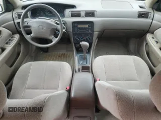 2001 Toyota Camry CE z VIN 4T1BG22K41U104477, wystawiony jako Copart lot #58437155 z przebiegiem 84 355 mil mil oraz Czysty tytuł • Clean title. Historia ofert i sprzedaży dostępna na DreamBid. Obrazek 8.