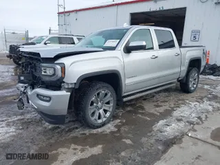 2018 GMC Sierra 1500 Denali with VIN 3GTU2PEJXJG472435, listed as a IAAI auction lot 41376821 with 63,177 mi miles. Bid and sale history available at carsss.com. Image 2.