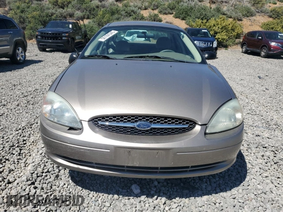 2003 Ford Taurus LX Standard z VIN 1FAFP52U63G277370, wystawiony jako Copart lot #56184345 z przebiegiem 115 778 mil mil oraz Szkoda całkowita • Salvage title. Historia ofert i sprzedaży dostępna na DreamBid. Obrazek 5.