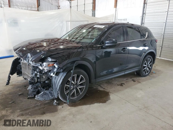 2018 Mazda CX-5 Grand Touring with VIN JM3KFBDM4J0412835, listed as a Copart auction lot 55441315 with 191,968 mi miles and Salvage title. Bid and sale history available at DreamBid. Image 1.