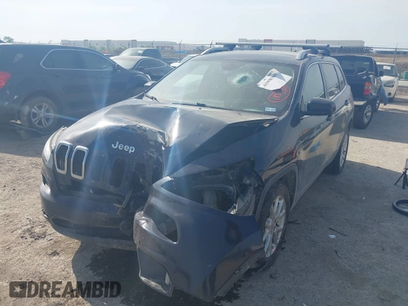 2015 Jeep Cherokee Latitude with VIN 1C4PJLCB9FW683459, listed as a IAAI auction lot 41998309 with 176,769 mi miles and . Bid and sale history available at carsss.com. Image 2.