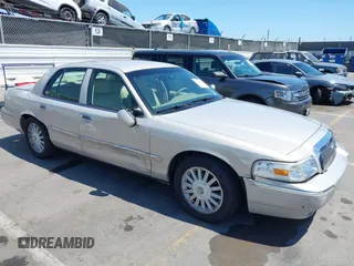 2008 Mercury Grand Marquis LS z VIN 2MEFM75V08X662376, wystawiony jako IAAI lot #42414652 z przebiegiem 86 537 mil mil oraz . Historia ofert i sprzedaży dostępna na DreamBid. Obrazek 1.