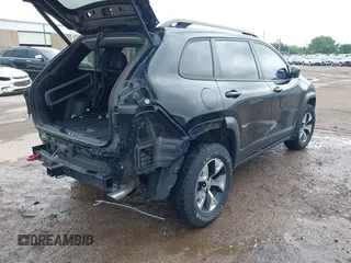 2015 Jeep Cherokee Trailhawk with VIN 1C4PJMBS5FW647601, listed as a IAAI auction lot 42437734 with 170,640 mi miles and . Bid and sale history available at DreamBid. Image 4.