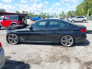 2019 BMW 5 Series M550i xDrive with VIN WBAJB9C51KB289355, listed as a IAAI auction lot 41867984 with 30,106 mi miles and . Bid and sale history available at DreamBid. Image 14.