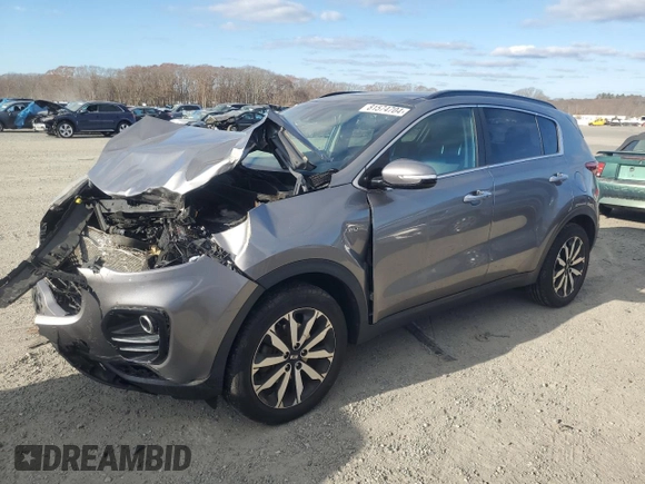 2018 Kia Sportage EX z VIN KNDPNCAC1J7308457, wystawiony jako Copart lot #81574704 z przebiegiem Nie podano mil oraz Szkoda całkowita • Salvage title. Historia ofert i sprzedaży dostępna na DreamBid. Obrazek 1.