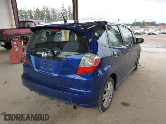 2009 Honda Fit Sport with VIN JHMGE88459C001743, listed as a IAAI auction lot 41852048 with 128,225 mi miles. Bid and sale history available at carsss.com. Image 4.