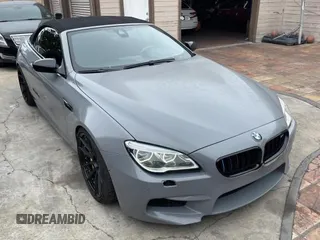 2016 BMW M6 z VIN WBS6G9C54GD932196, wystawiony jako Copart lot #53960063 z przebiegiem 46 162 mil mil oraz . Historia ofert i sprzedaży dostępna na DreamBid. Obrazek 1.