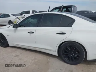 2015 Infiniti Q50 z VIN JN1BV7APXFM335981, wystawiony jako IAAI lot #41718555 z przebiegiem 83 918 mil mil oraz . Historia ofert i sprzedaży dostępna na DreamBid. Obrazek 13.