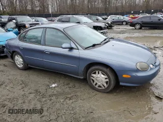 1999 Ford Taurus SE z VIN 1FAFP53U4XG150881, wystawiony jako Copart lot #40964564 z przebiegiem 124 928 mil mil oraz Tytuł czysty. Historia ofert i sprzedaży dostępna na DreamBid. Obrazek 4.