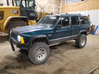 1996 Jeep Cherokee Sport with VIN 1J4FJ68S1TL226495, listed as a Copart auction lot 58587685 with 205,397 mi miles and Salvage title. Bid and sale history available at DreamBid. Image 1.
