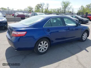 2007 Toyota Camry CE with VIN JTNBE46K373056707, listed as a IAAI auction lot 42128026 with 242,887 mi miles. Bid and sale history available at carsss.com. Image 4.