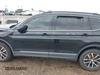 2021 Volkswagen Tiguan SE z VIN 3VV3B7AX7MM004286, wystawiony jako IAAI lot #39864219 z przebiegiem 67 429 mil mil oraz . Historia ofert i sprzedaży dostępna na DreamBid. Obrazek 14.