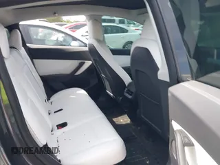 2022 Tesla Model Y Long Range z VIN 7SAYGDEE2NF447998, wystawiony jako IAAI lot #41704968 z przebiegiem 34 088 mil mil oraz . Historia ofert i sprzedaży dostępna na DreamBid. Obrazek 8.