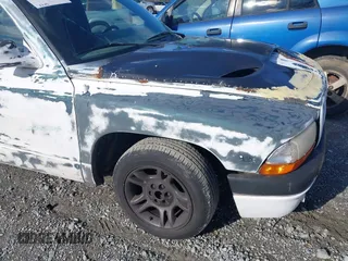 1998 Dodge Dakota SLT z VIN 1B7FL26X7WS586596, wystawiony jako IAAI lot #41745358 z przebiegiem 173 950 mil mil oraz . Historia ofert i sprzedaży dostępna na DreamBid. Obrazek 12.