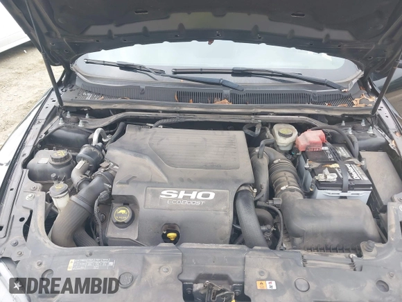 2015 Ford Taurus SHO with VIN 1FAHP2KT7FG148444, listed as a IAAI auction lot 40788614 with 121,533 mi miles and . Bid and sale history available at DreamBid. Image 10.