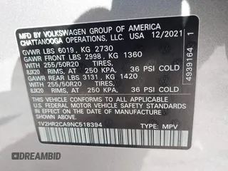 2022 Volkswagen Atlas SE z VIN 1V2HR2CA9NC518394, wystawiony jako IAAI lot #41702134 z przebiegiem 28 685 mil mil oraz . Historia ofert i sprzedaży dostępna na DreamBid. Obrazek 9.
