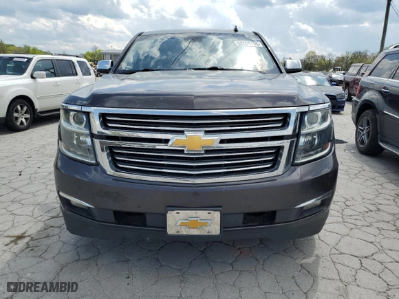 2015 Chevrolet Suburban LTZ with VIN 1GNSCKKCXFR216890, listed as a Copart auction lot 52695155 with 233,296 mi miles and Clean Title. Bid and sale history available at carsss.com. Image 5.
