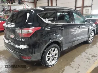 2017 Ford Escape SE with VIN 1FMCU9GD8HUE81307, listed as a IAAI auction lot 41386675 with 133,821 mi miles and . Bid and sale history available at DreamBid. Image 4.