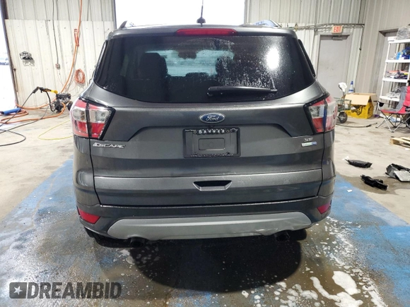 2018 Ford Escape SE with VIN 1FMCU9G90JUB48553, listed as a Copart auction lot 51171255 with 134,423 mi miles and Salvage Title. Bid and sale history available at carsss.com. Image 6.
