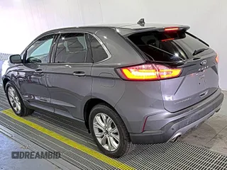 2021 Ford Edge Titanium z VIN 2FMPK3K92MBA53689, wystawiony jako IAAI lot #42501151 z przebiegiem 93 941 mil mil oraz . Historia ofert i sprzedaży dostępna na DreamBid. Obrazek 20.